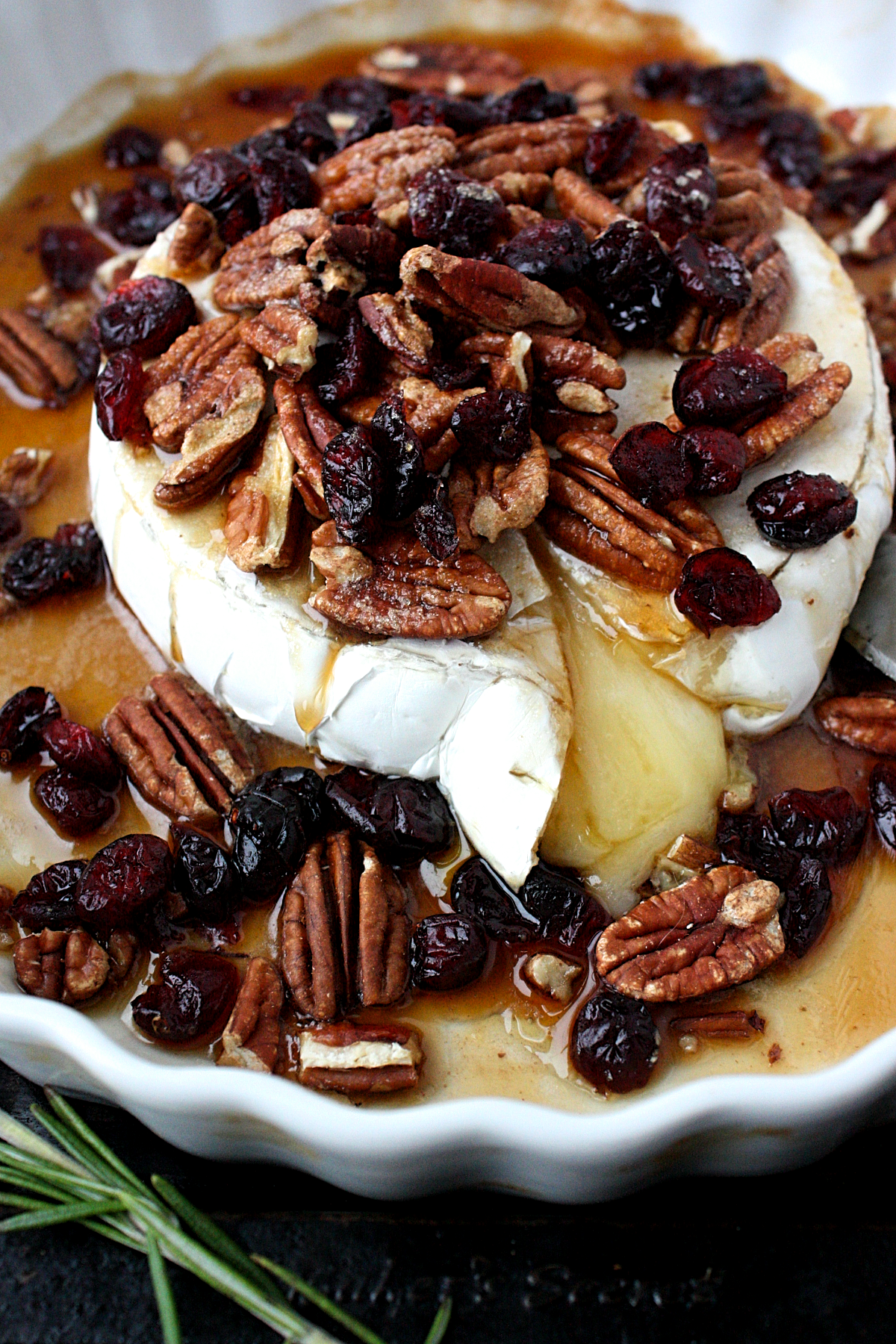 baked maple brie with pecans and cranberries