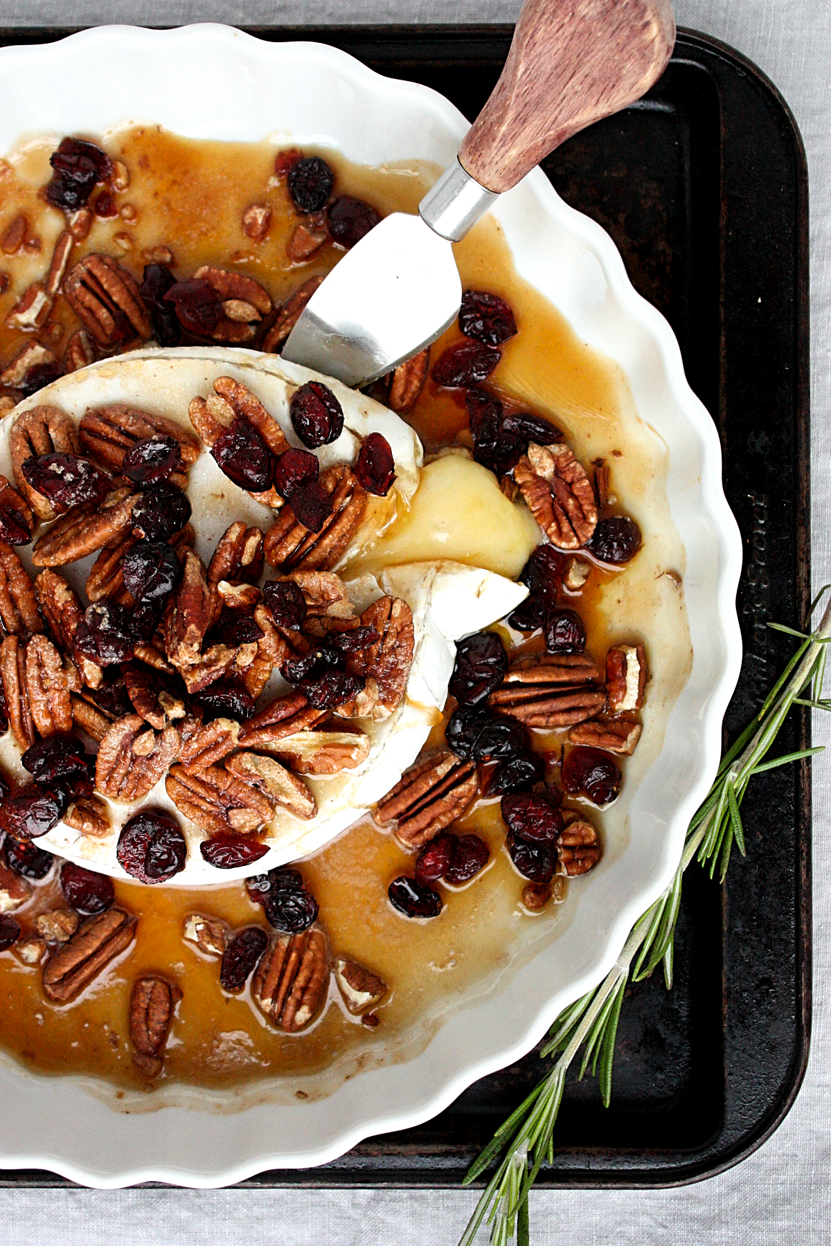 baked maple brie with pecans and cranberries