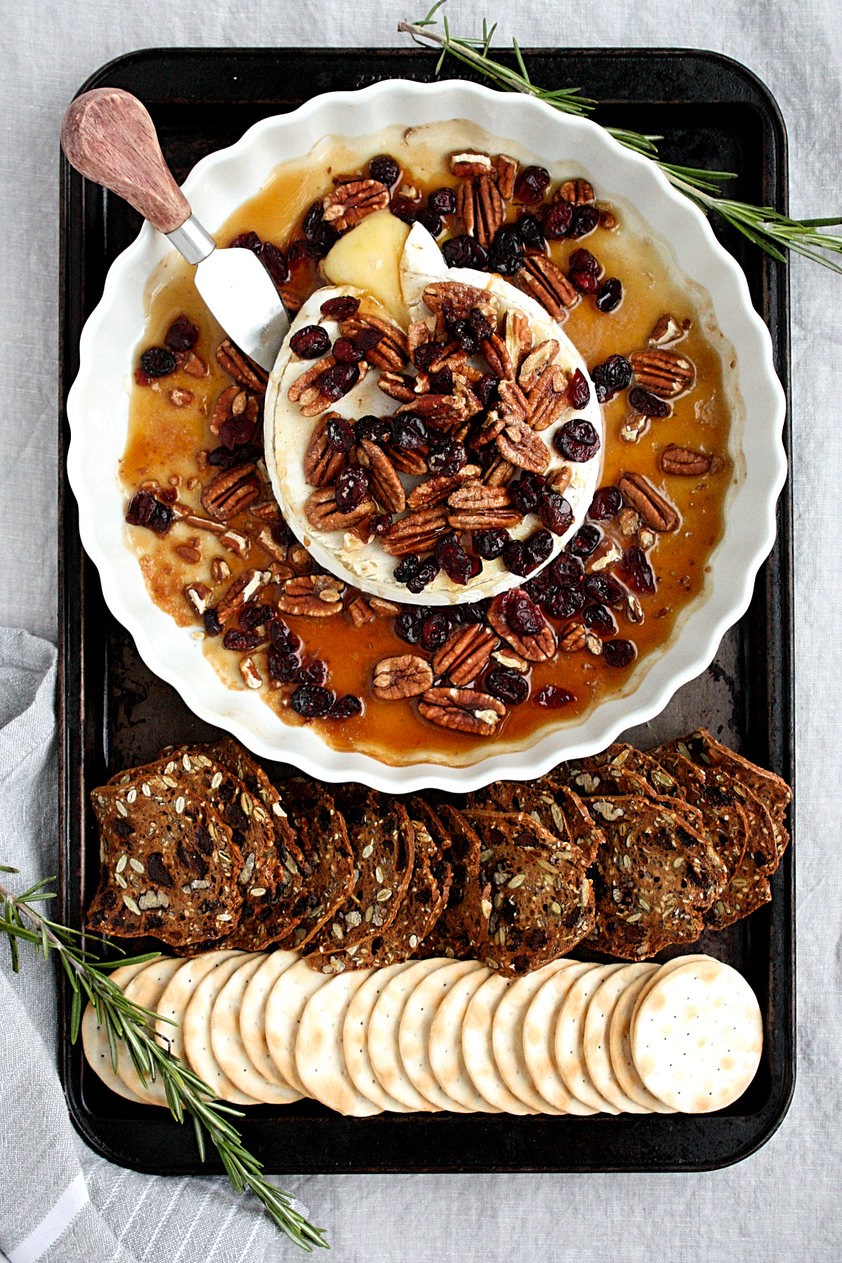 baked maple brie with pecans and cranberries