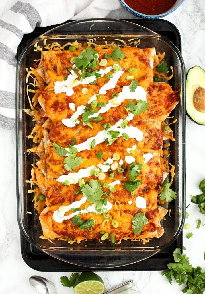 Veggie Enchiladas with Quinoa and Black Beans || These hearty veggie enchiladas are loaded with quinoa, spinach, black beans, spices and topped with an easy homemade enchilada sauce. #mondaysundaykitchen