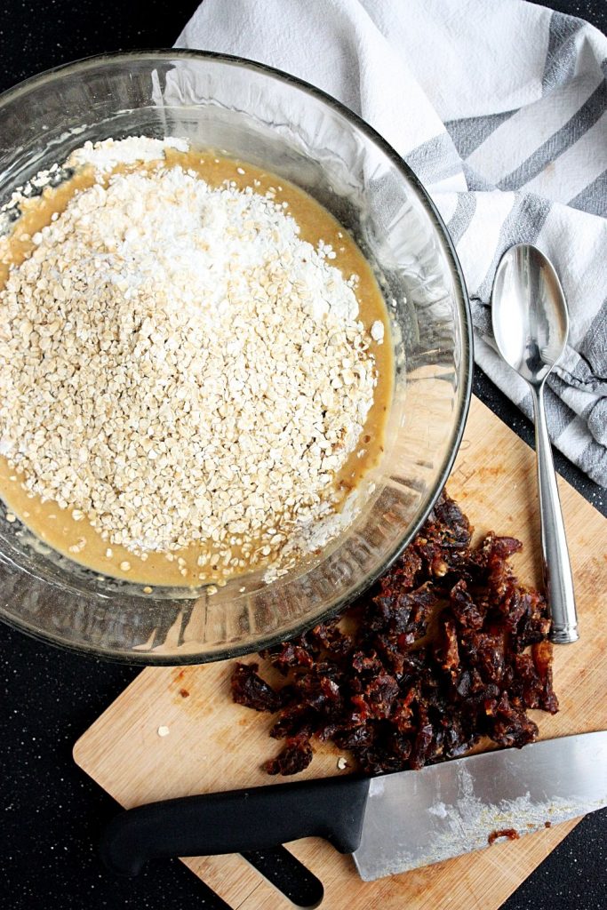 Add chopped dates to the breakfast cookie mixture.