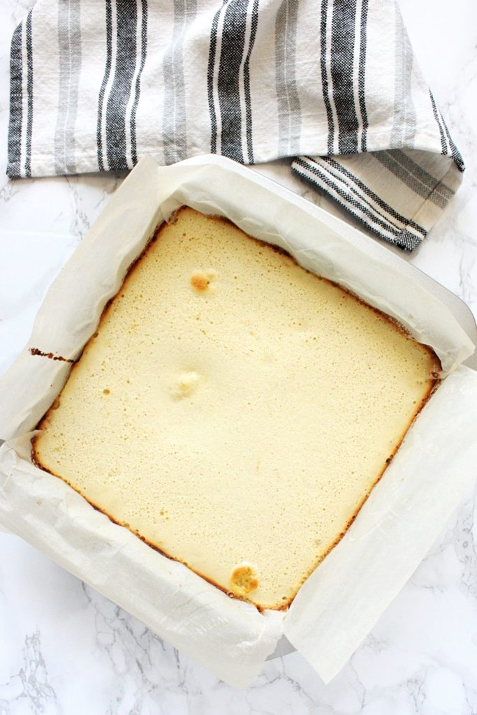 Lemon squares in a pan right out of the oven.