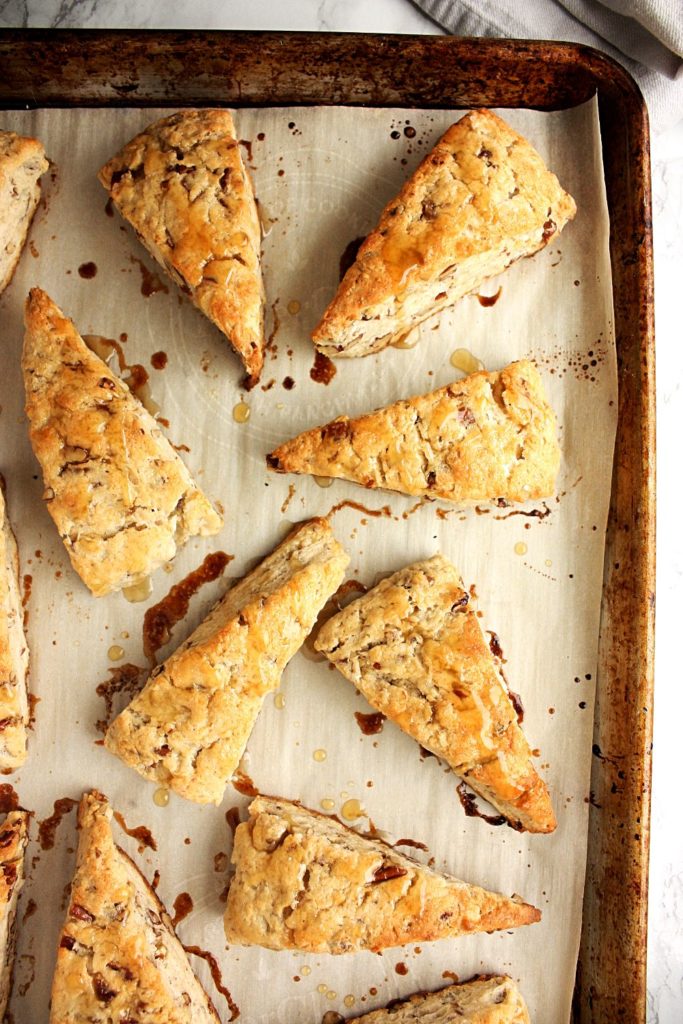 Maple pecan scones on a baking tray just out of the oven