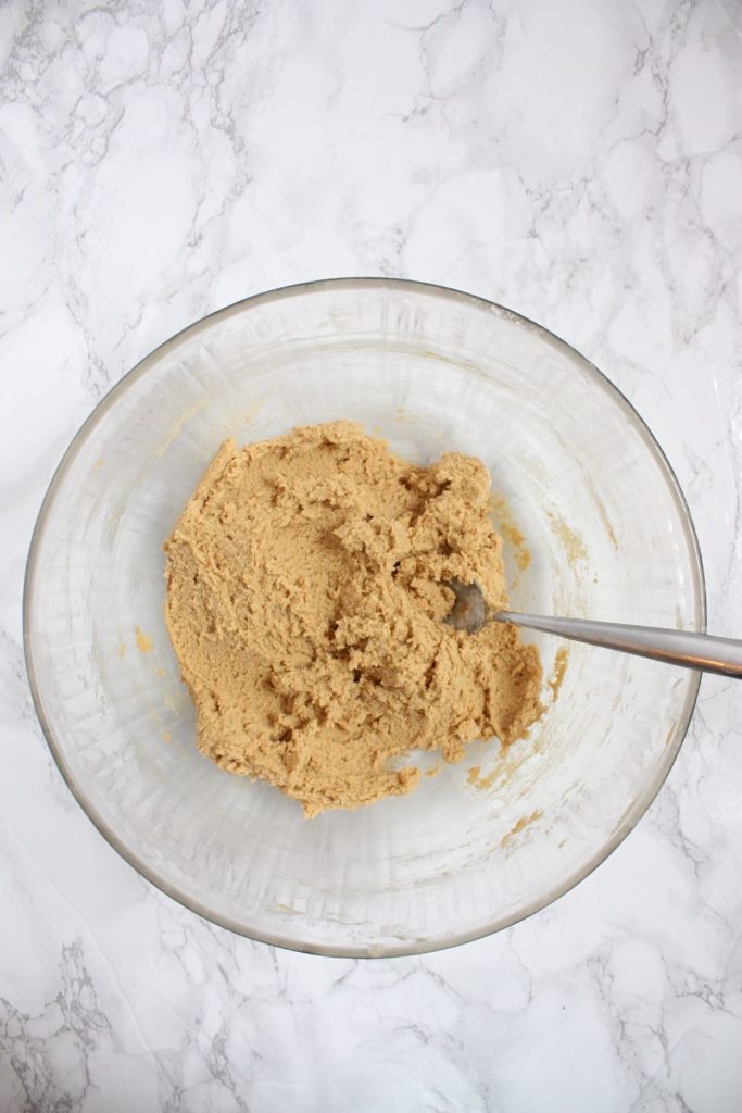 The peanut butter cookie dough in a mixing bowl, ready to be scooped into cookies.