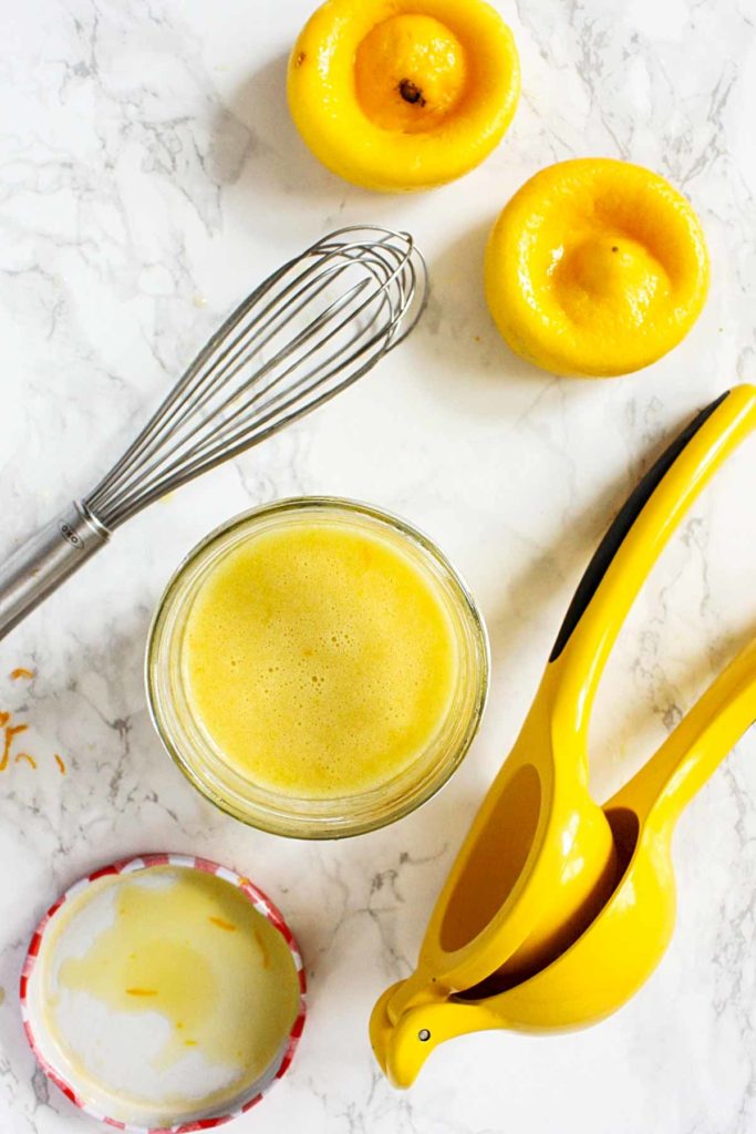 Citrus dressing in a small mason jar.